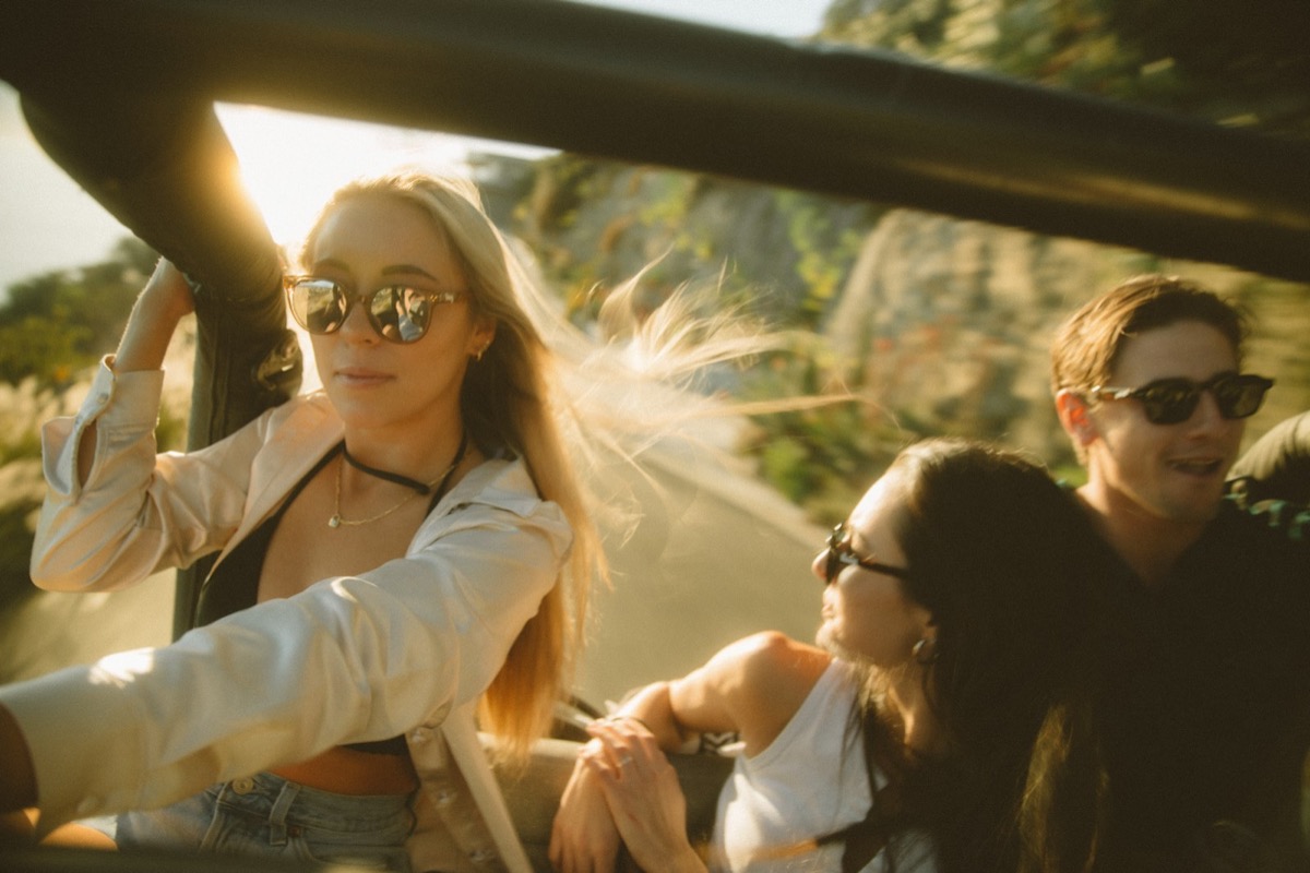 Friends riding together with the wind in their hair